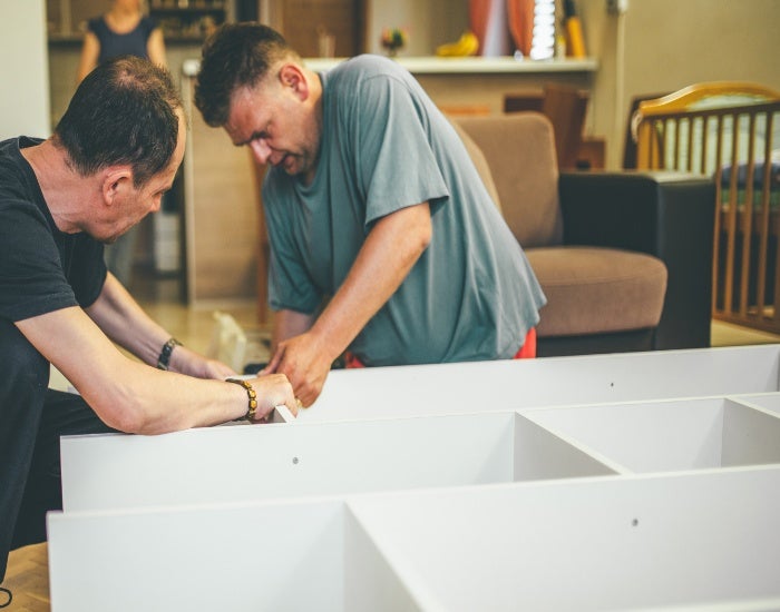 Person assembling furniture for home interior