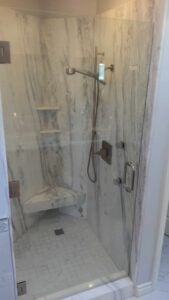 A bathroom with marble tiles and shower in San Diego, CA