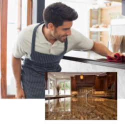 A man cleaning the kitchen's platform wearing an apron in San Diego